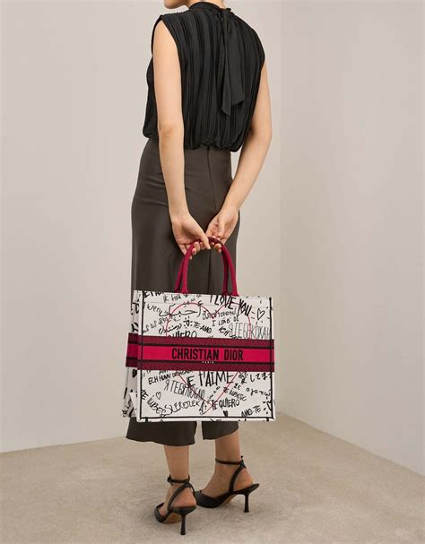 dior book tote with dioramour graffiti|dior designer tote bag.